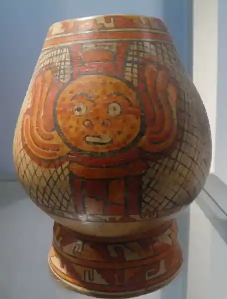 Polychrome Papagayo, winged disc with face